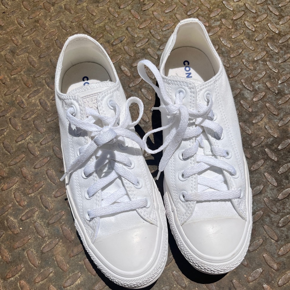 Converse white low tops.